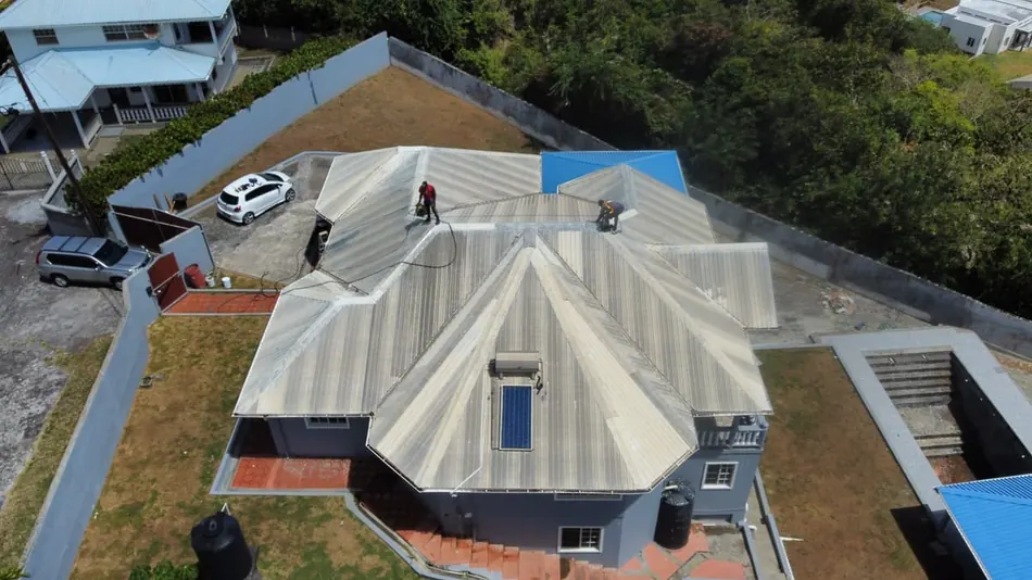 Aerial view of a whole-roof clean in progress