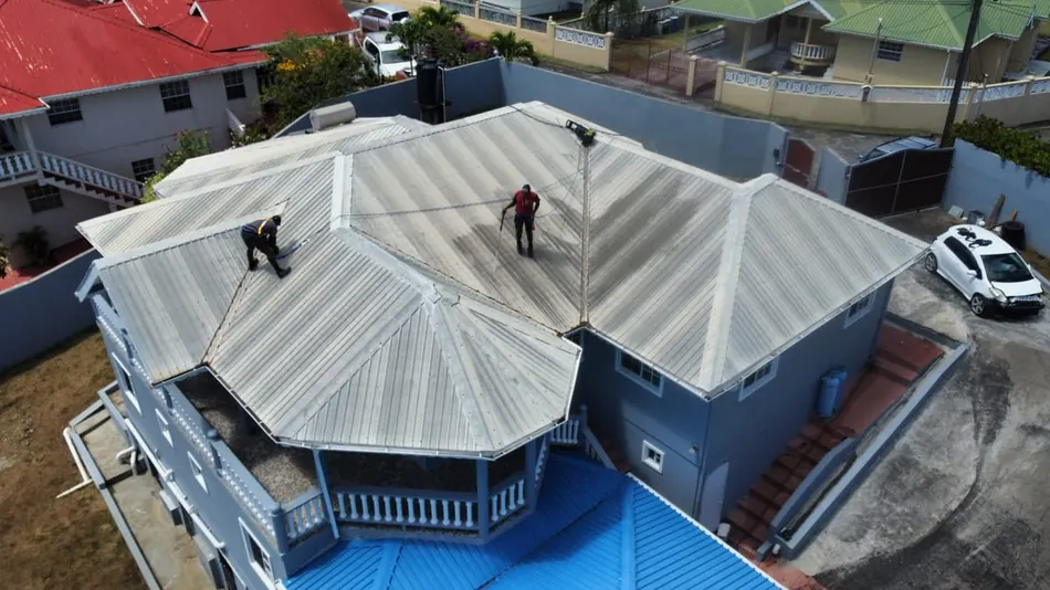 Crew washing a residential roof